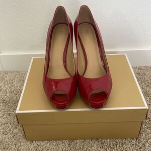 Amazing red shoes worn once.  Comfortable platform making it easy to walk.